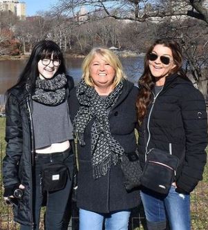 In the picture, Gretchen Wilson, her daughter Grace Frances Penner and her mother