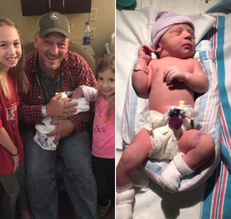 Chase Landry's father, Troy Landry, with his newly born granddaughter in 2017.