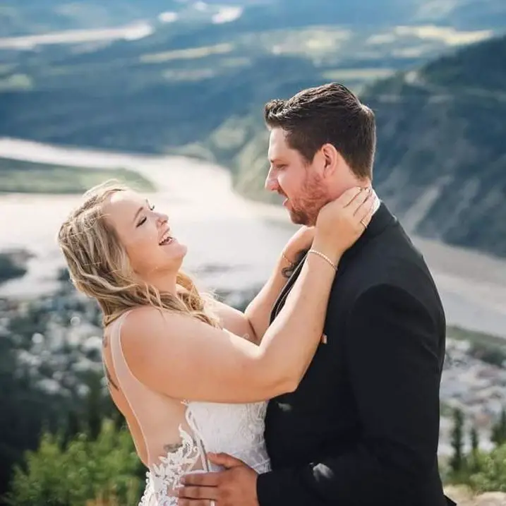 Monica Beets embraces her husband, Taylor Maynes on their wedding ceremony ...