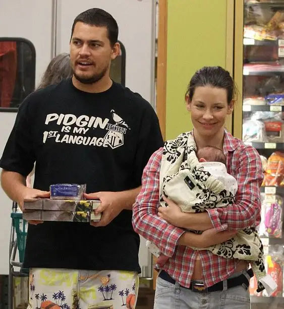 Evangeline Lily and her boyfriend, Norman Kali, at a store with their toddler son 