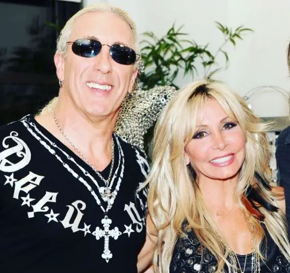 Suzette Snider posing with her husband, Dee Snider. 