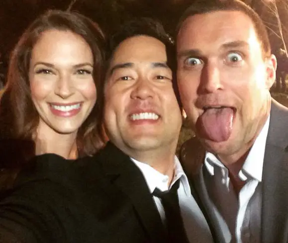 Tim Kang taking a selfie with his co-actors, Owain Yeoman and Amanda Righetti.