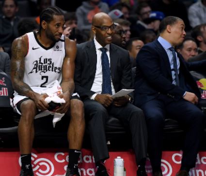 Sam sitting court-side besides Kawhi Leonardanalyzing the gameplay as an assistant coach 