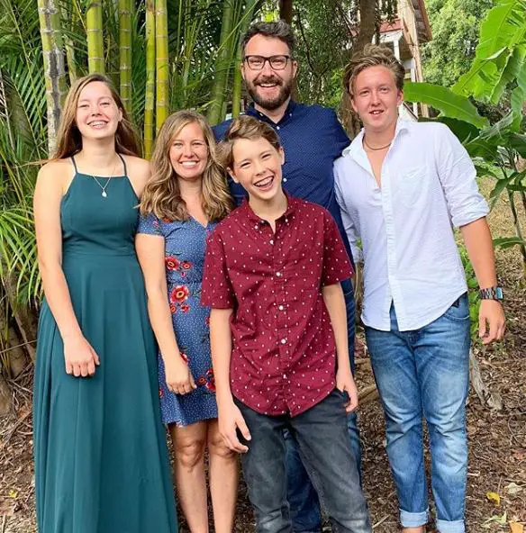 Peyton Coffee (left) poses for a family picture with her parents, Jason Cof...